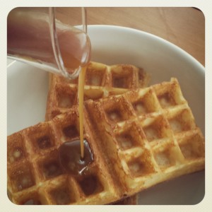 Picture of Elizabeth Marshall's Yeast Raised Wafffles with bourbon caramel sauce being poured over